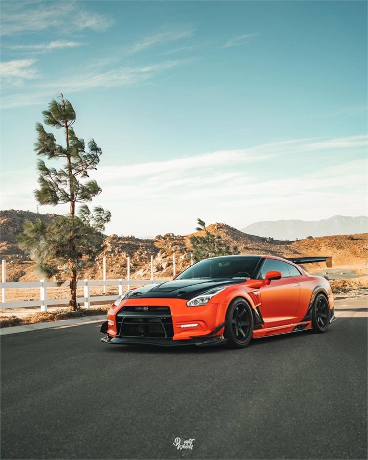 Orange performance car photographed for Valenz Autobody